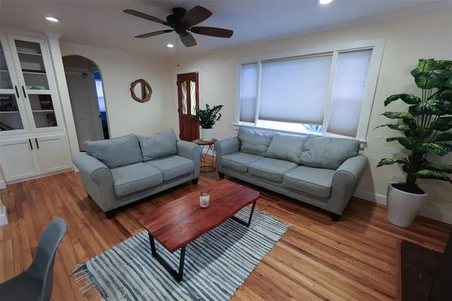 a living room with furniture and a rug