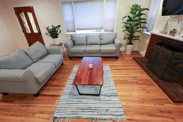a living room with furniture and a rug