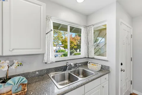 a kitchen with a sink and a window