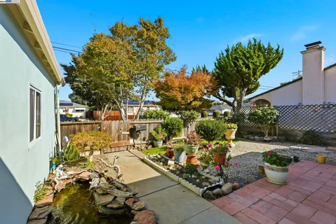 a outdoor living space with furniture and garden view