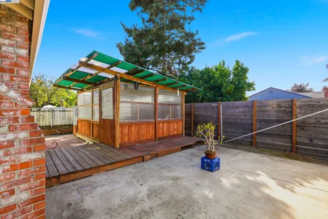 a view of a backyard with a sitting area