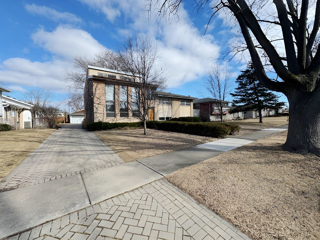 2736 Helen Drive Glenview, IL 60025 - Photo 13 of 47 a view of a house with a snow in the yard