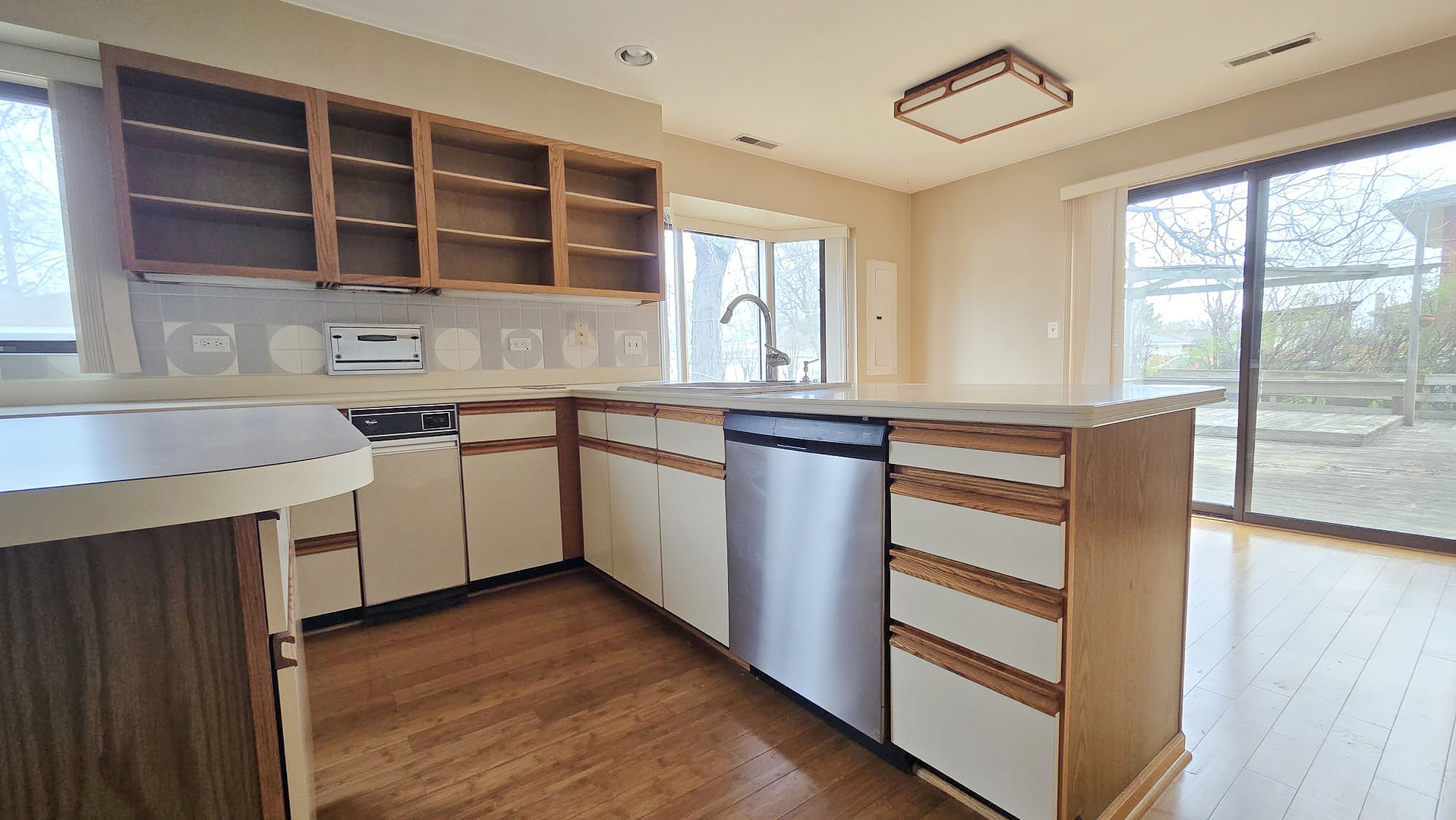 2736 Helen Drive Glenview, IL 60025 - Photo 18 of 47 a kitchen with a sink window and cabinets