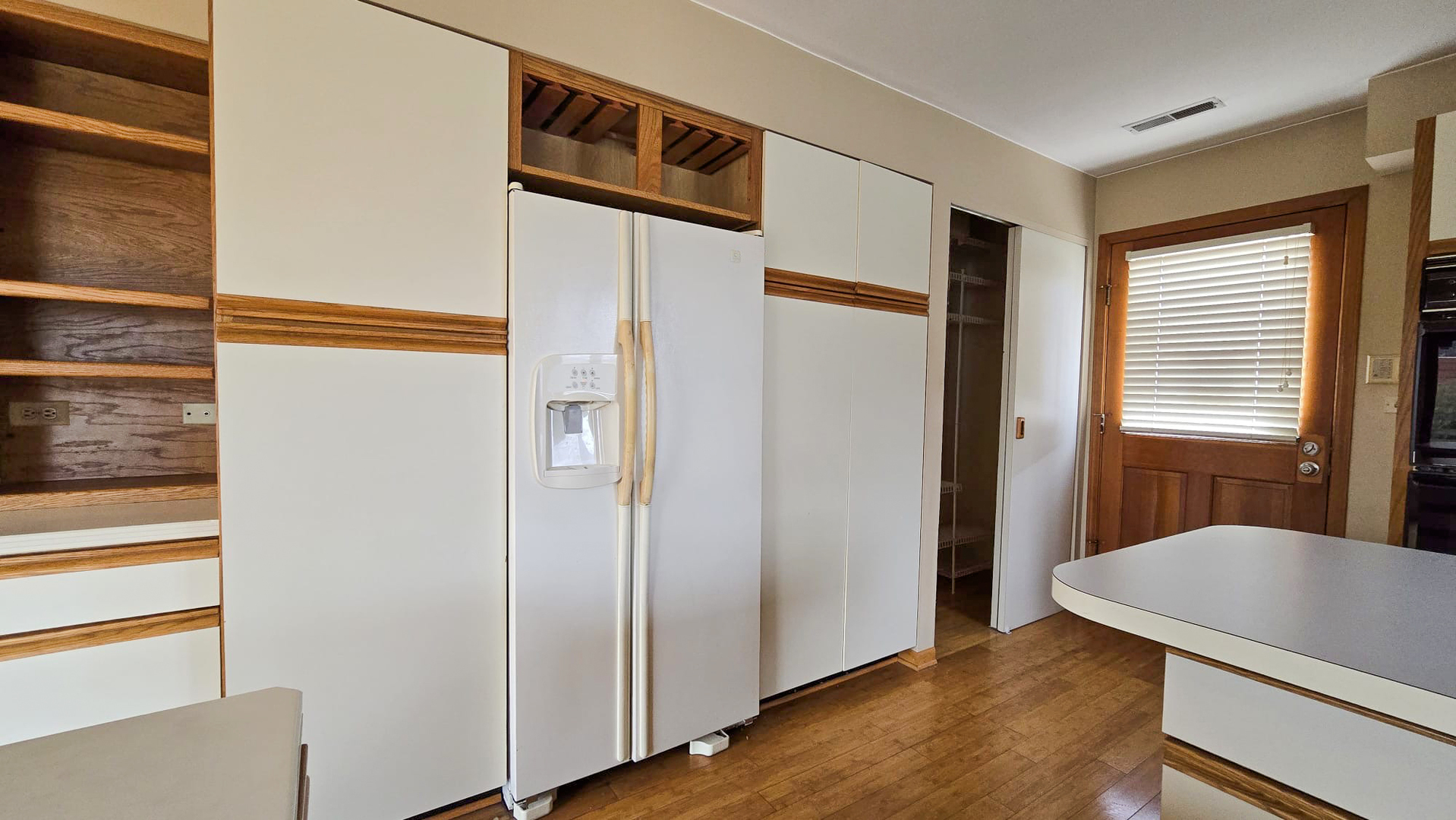 2736 Helen Drive Glenview, IL 60025 - Photo 19 of 47 a view of a hallway with wooden floor and staircase