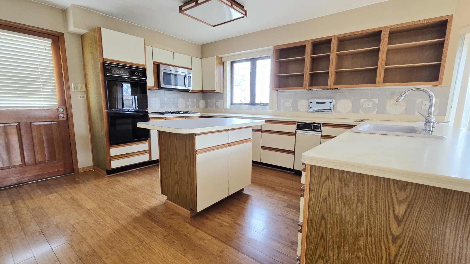 2736 Helen Drive Glenview, IL 60025 - Photo 22 of 47 a kitchen with stainless steel appliances granite countertop a stove and a sink