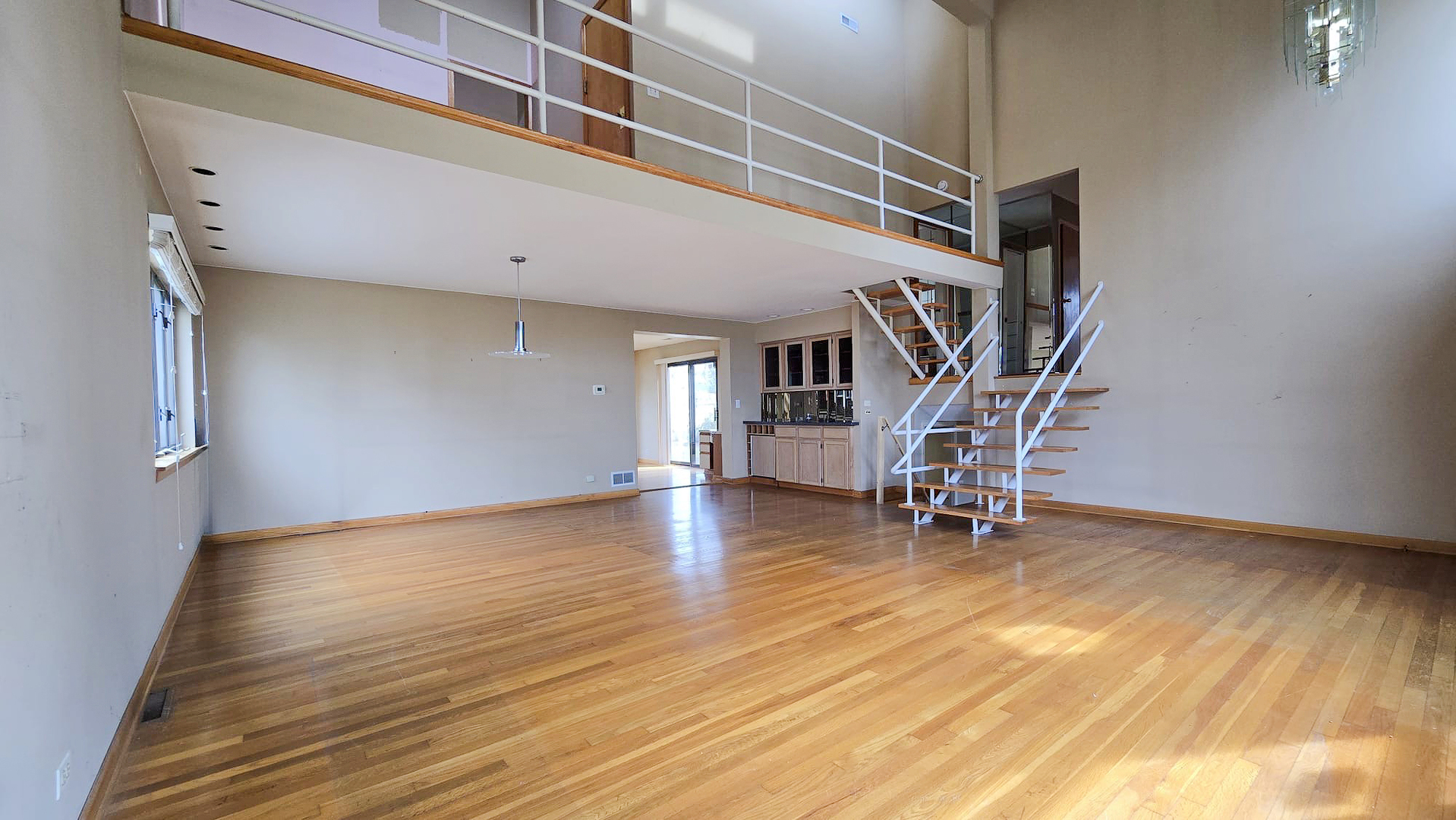 2736 Helen Drive Glenview, IL 60025 - Photo 25 of 47 a view of a room with wooden floor and stairs