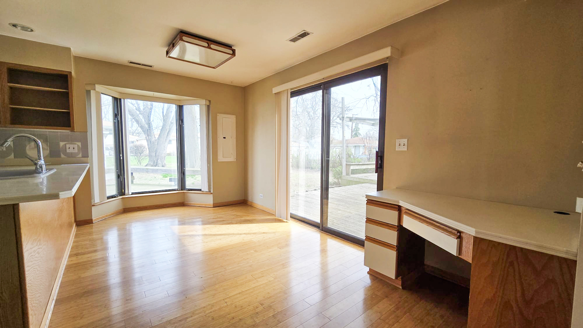 2736 Helen Drive Glenview, IL 60025 - Photo 28 of 47 a view of an empty room with a window and wooden floor