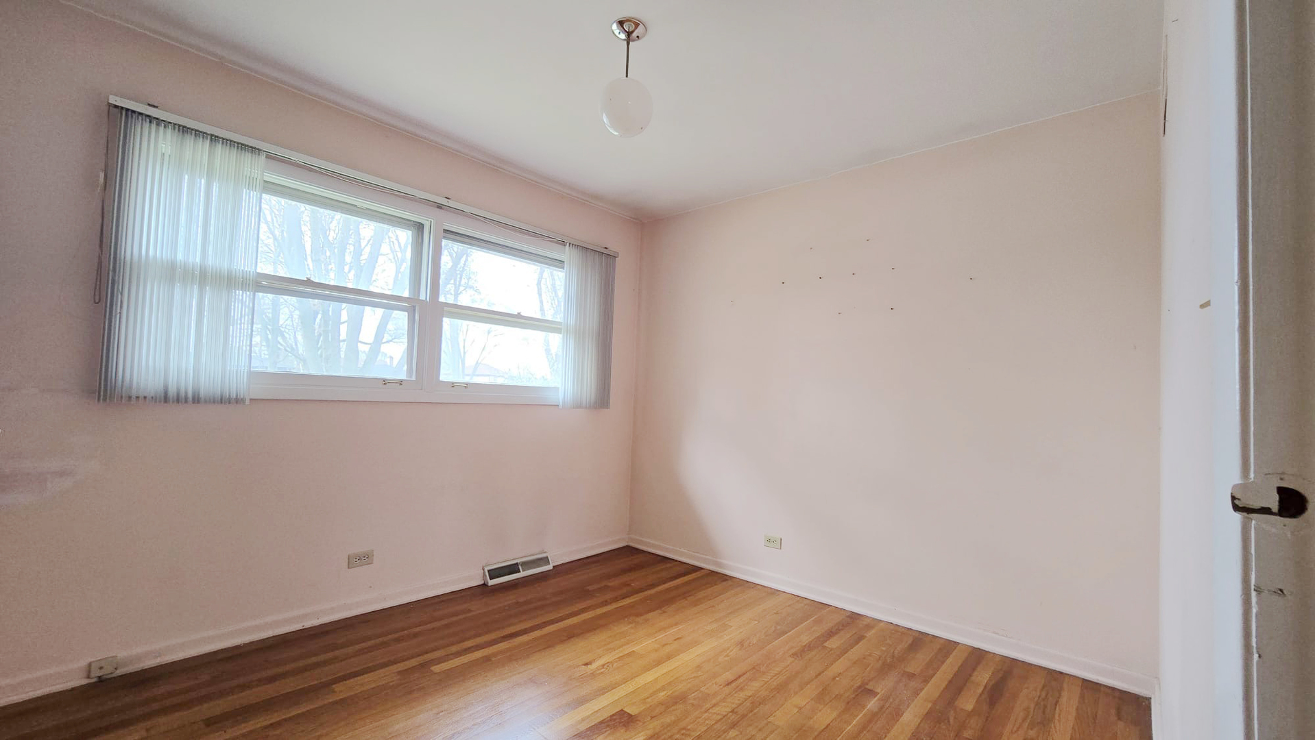 2736 Helen Drive Glenview, IL 60025 - Photo 42 of 47 an empty room with wooden floor and windows