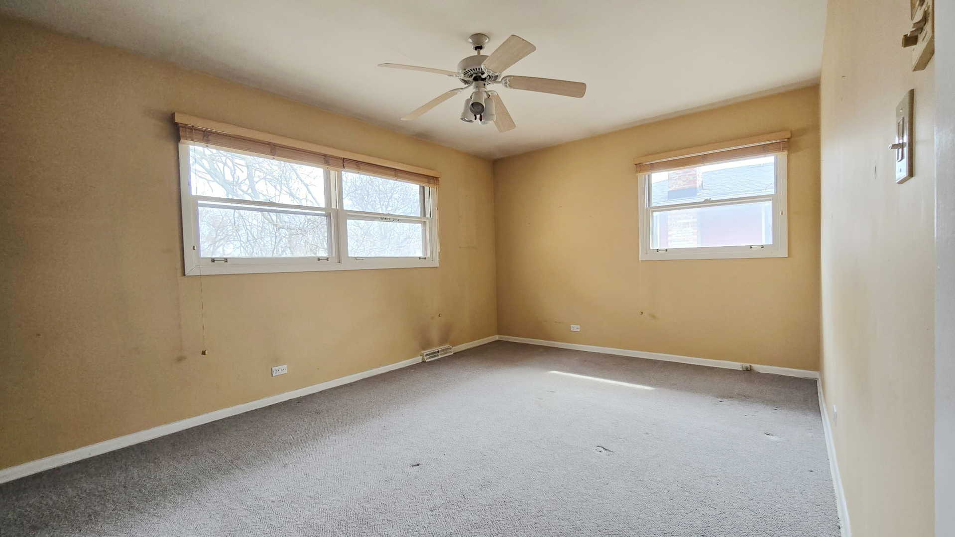 2736 Helen Drive Glenview, IL 60025 - Photo 44 of 47 an empty room with a window and a ceiling fan