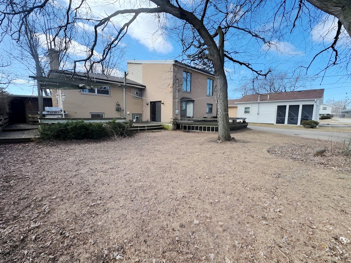 2736 Helen Drive Glenview, IL 60025 - Photo 10 of 47 a view of a house with a yard and garage