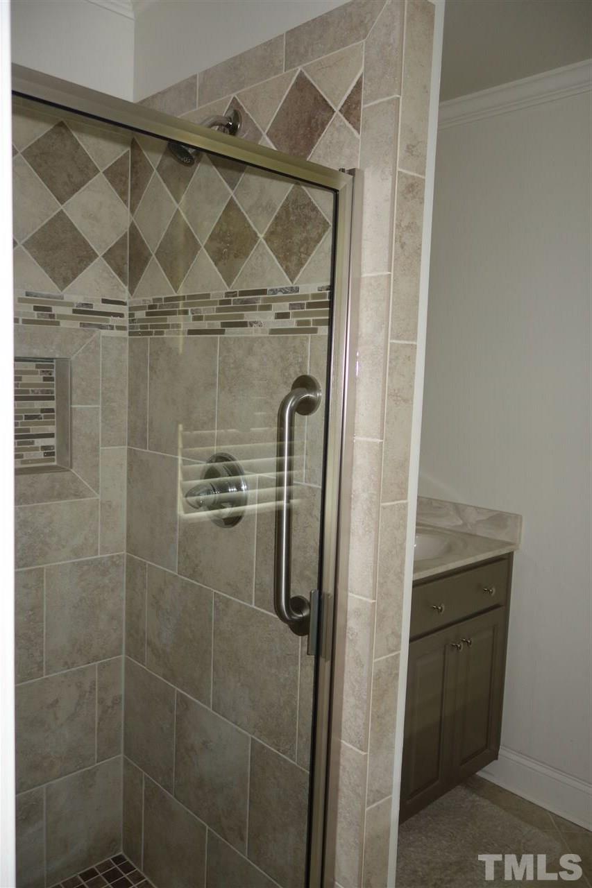 5700 Raleigh Road Kittrell, NC 27544 - Photo 11 of 20 In the master bath is a tiled shower - recently installed