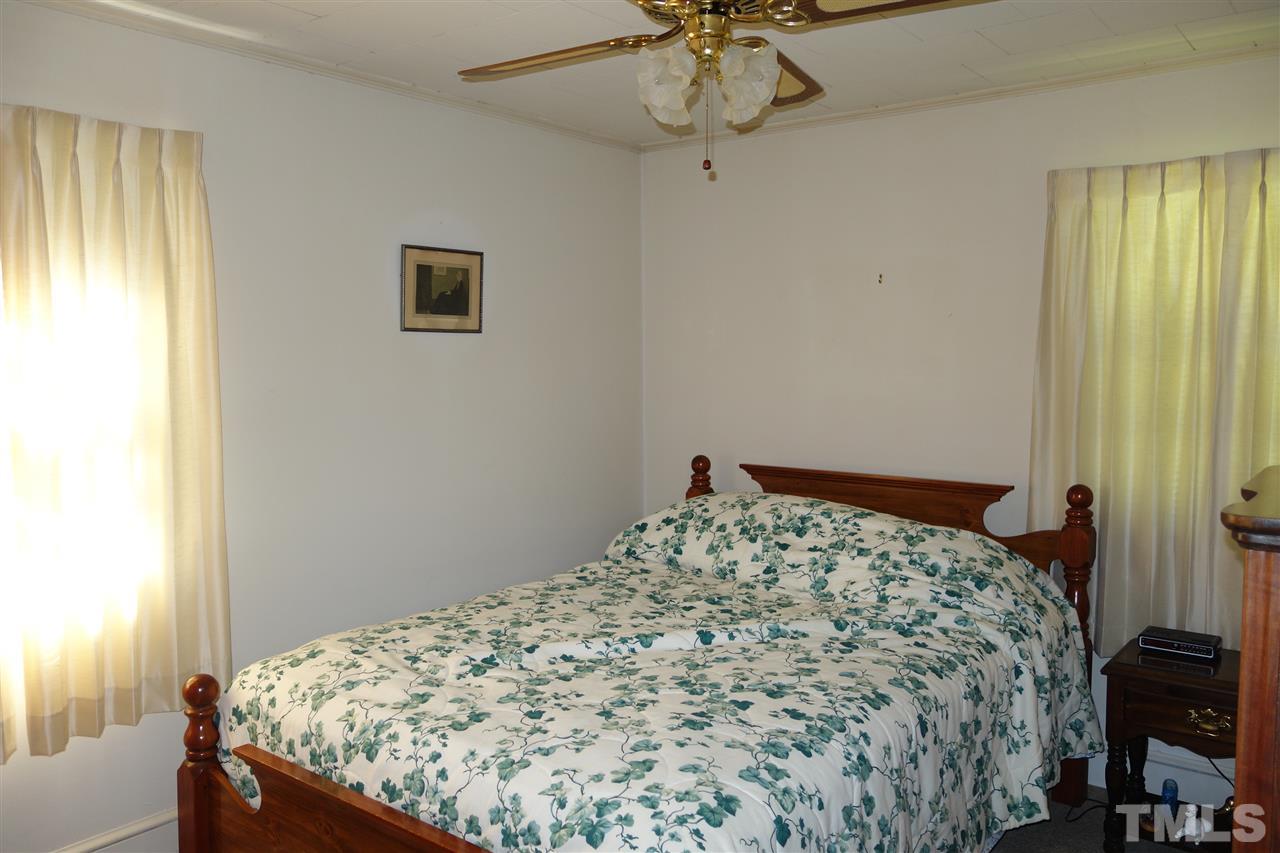 5700 Raleigh Road Kittrell, NC 27544 - Photo 14 of 20 One of the other two bedrooms - there is hardwood showing in the closet
