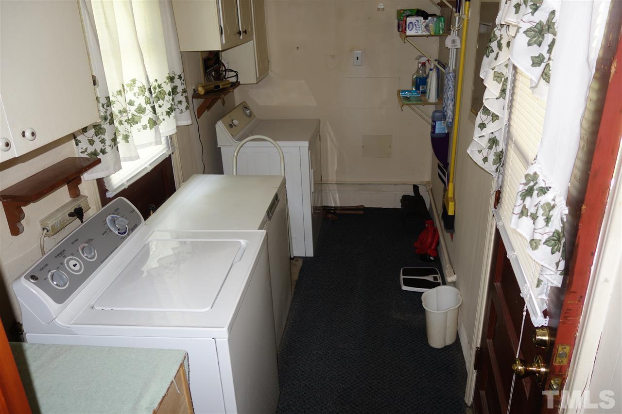 5700 Raleigh Road Kittrell, NC 27544 - Photo 17 of 20 Long laundry room with a door to the carport and one to the exterior
