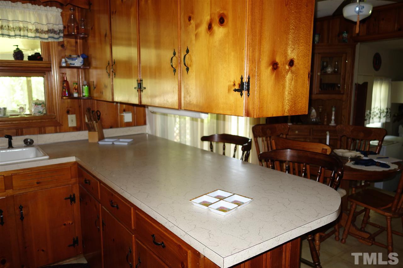 5700 Raleigh Road Kittrell, NC 27544 - Photo 5 of 20 An eating counter between the kitchen and dining area