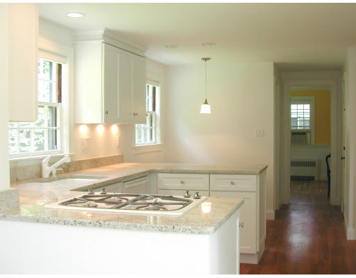 26 Richland Road Wellesley, MA 02481 - Photo 4 of 9 a bathroom with a granite countertop sink and a mirror