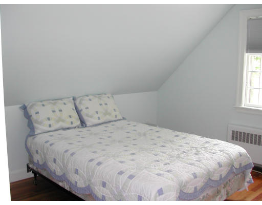 26 Richland Road Wellesley, MA 02481 - Photo 8 of 9 a bedroom with a bed and a window