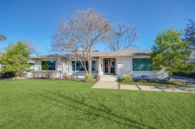 a view of a house with a yard porch and sitting area