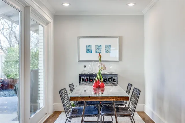 a dining room with furniture and a window