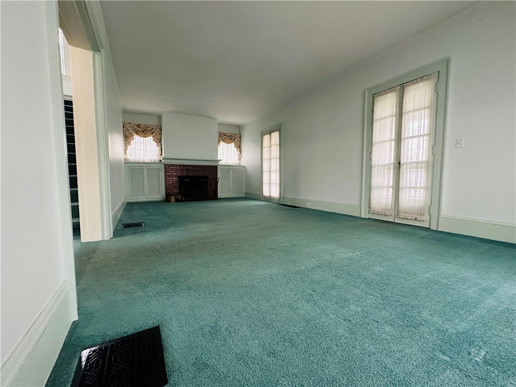 263 East Genesee Street Auburn, NY 13021 - Photo 13 of 50 The living room with two sets of french doors that open to the front porch.
