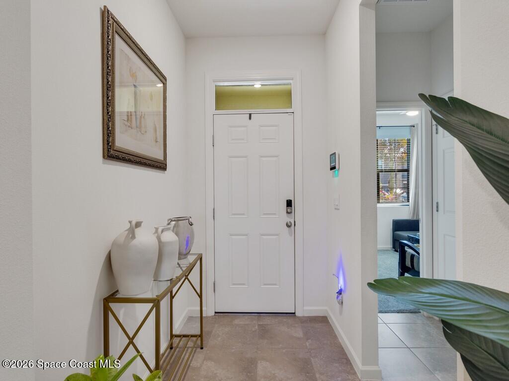 645 Old Country Rd S East Palm Bay, FL 32909 - Photo 11 of 42 a view of a hallway with seating area