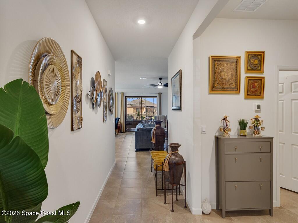645 Old Country Rd S East Palm Bay, FL 32909 - Photo 12 of 42 a living room with furniture and wooden floor