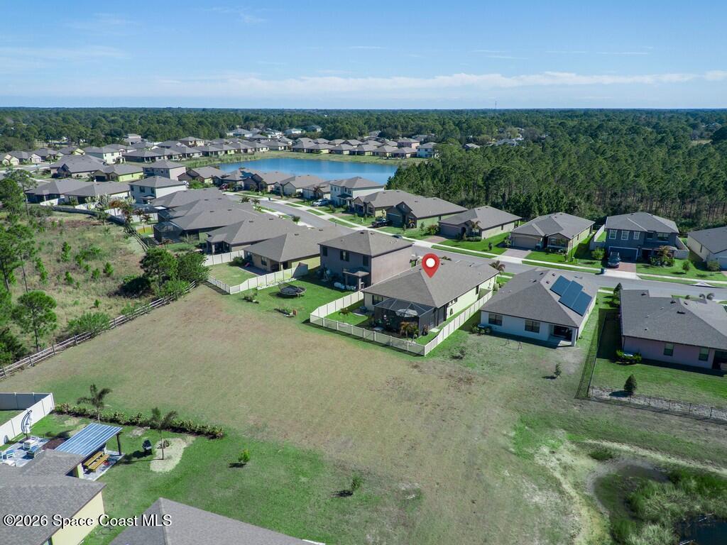 645 Old Country Rd S East Palm Bay, FL 32909 - Photo 21 of 42 an aerial view of a house with garden space and street view
