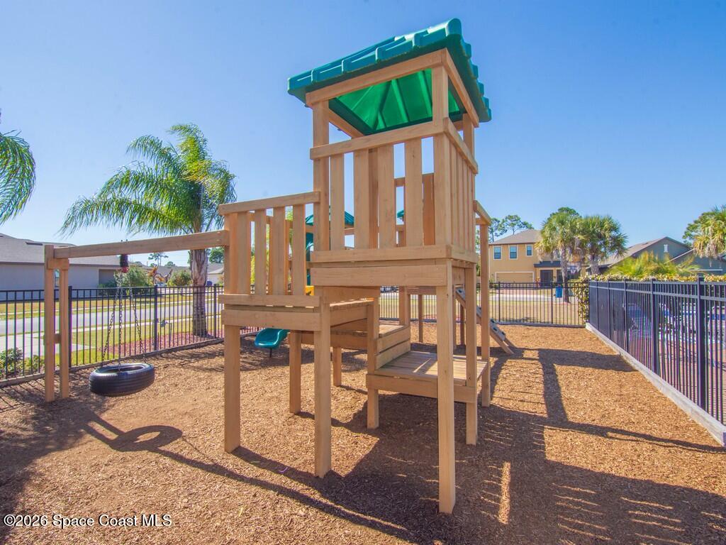 645 Old Country Rd S East Palm Bay, FL 32909 - Photo 33 of 42 a front view of a house with outdoor seating