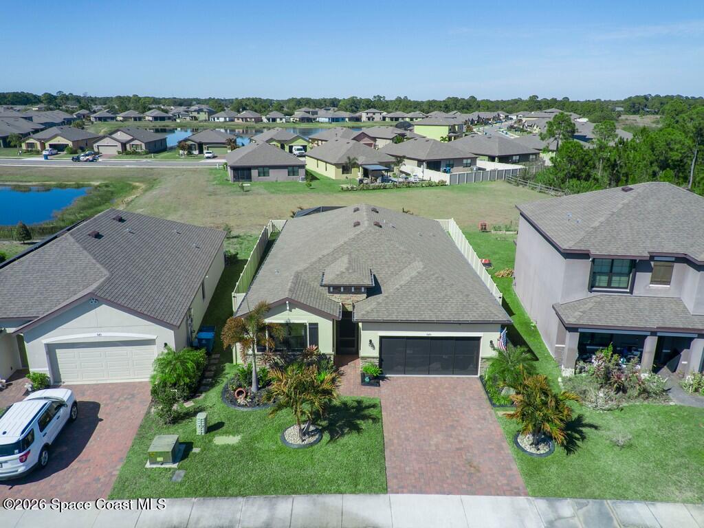 645 Old Country Rd S East Palm Bay, FL 32909 - Photo 35 of 42 an aerial view of a house with garden space and outdoor space