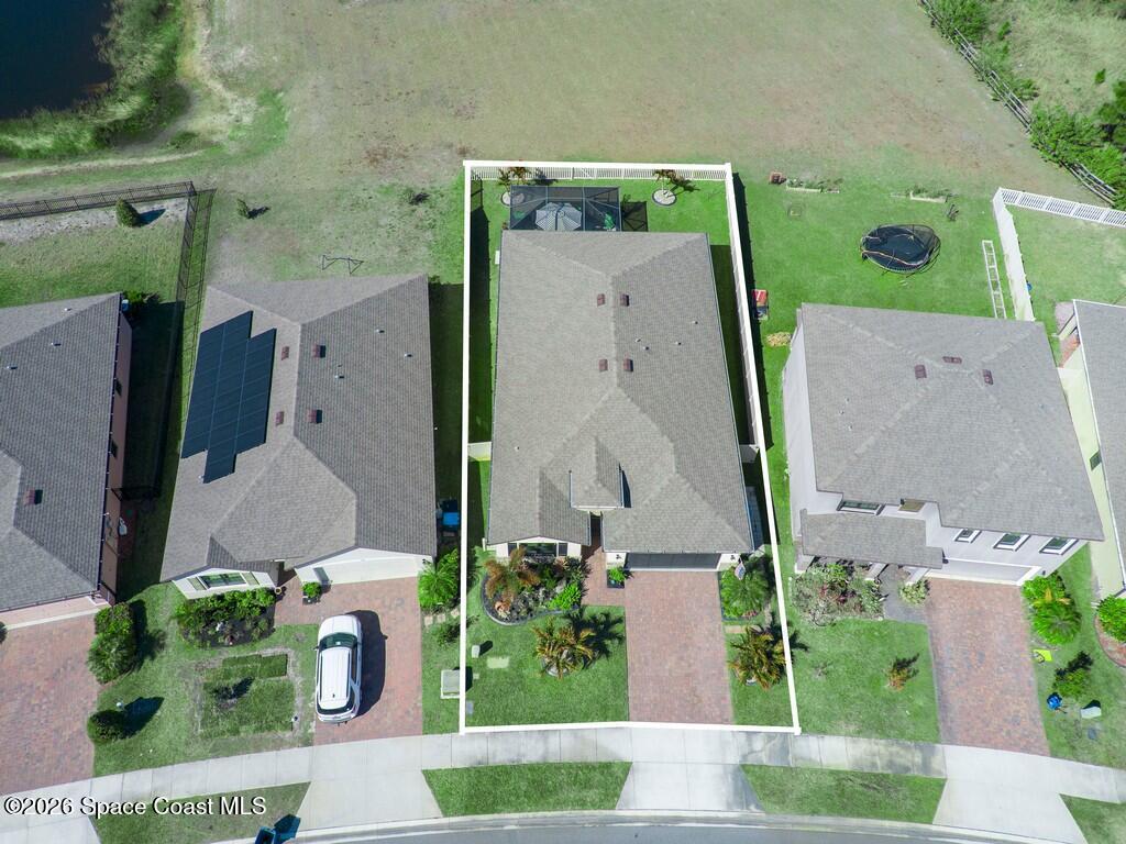 645 Old Country Rd S East Palm Bay, FL 32909 - Photo 36 of 42 an aerial view of a house with a yard