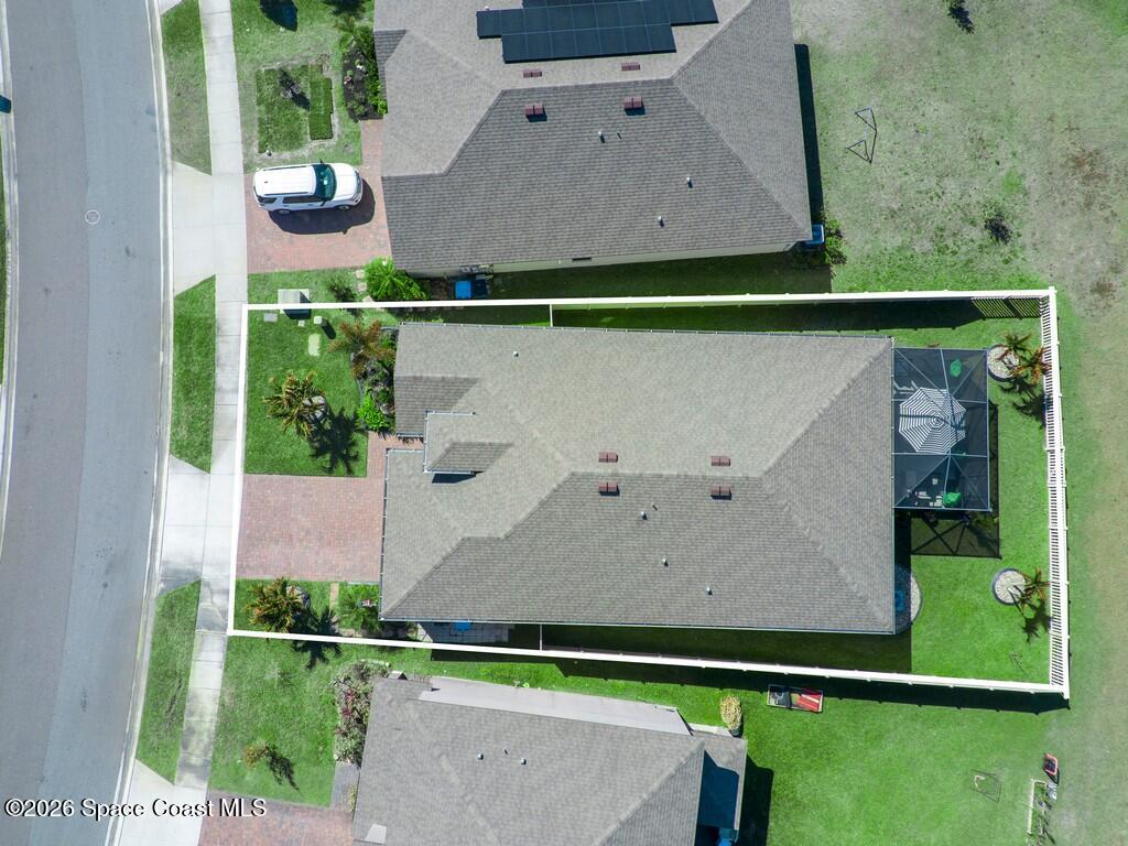 645 Old Country Rd S East Palm Bay, FL 32909 - Photo 37 of 42 an aerial view of house with yard