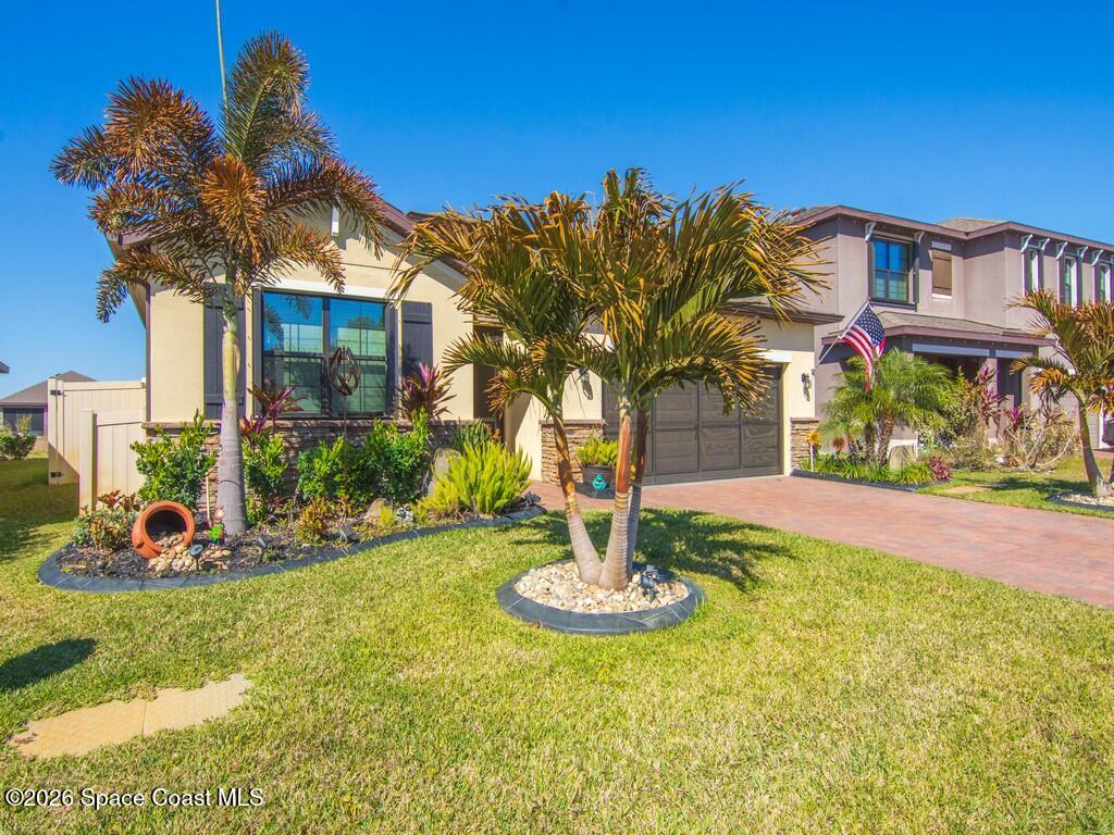 645 Old Country Rd S East Palm Bay, FL 32909 - Photo 42 of 42 a front view of a house with a yard