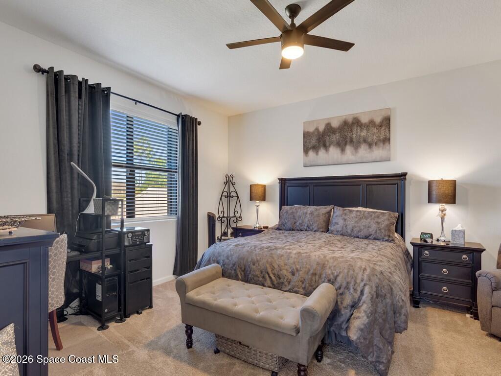 645 Old Country Rd S East Palm Bay, FL 32909 - Photo 6 of 42 a bedroom with a bed and wooden floor