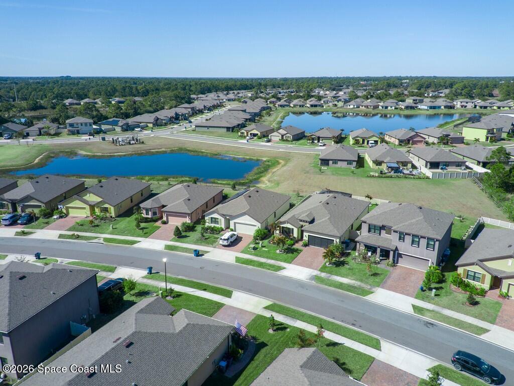 645 Old Country Rd S East Palm Bay, FL 32909 - Photo 8 of 42 an aerial view of residential houses with outdoor space