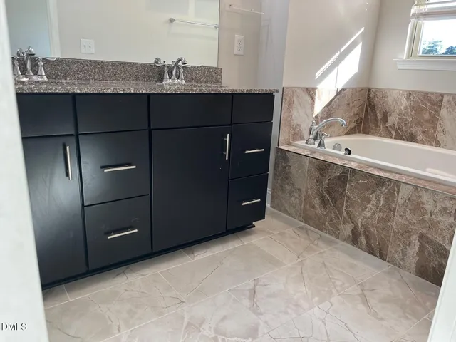 a bathroom with a shower and toilet