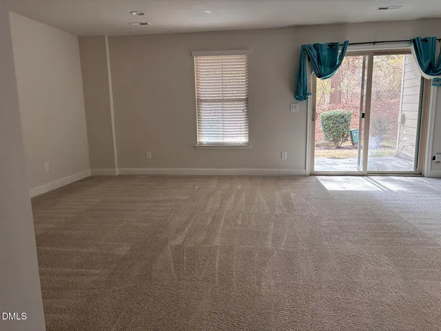 a kitchen with kitchen island a counter top space cabinets and stainless steel appliances