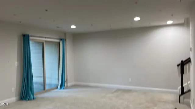 an empty room with a bathroom