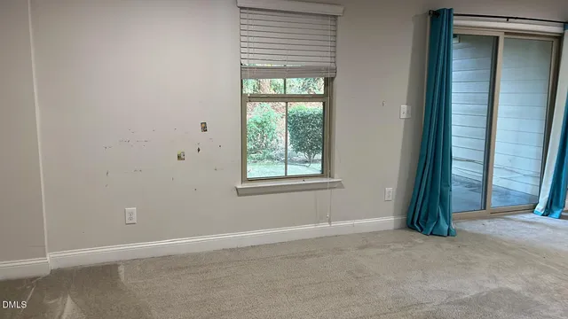 an empty room with windows