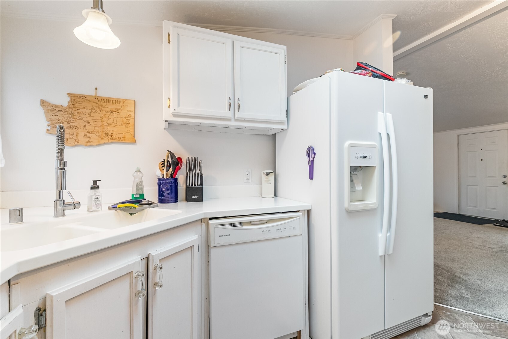 2350 Douglas Road, Unit 17 Ferndale, WA 98248 - Photo 19 of 32 a kitchen with white cabinets and refrigerator