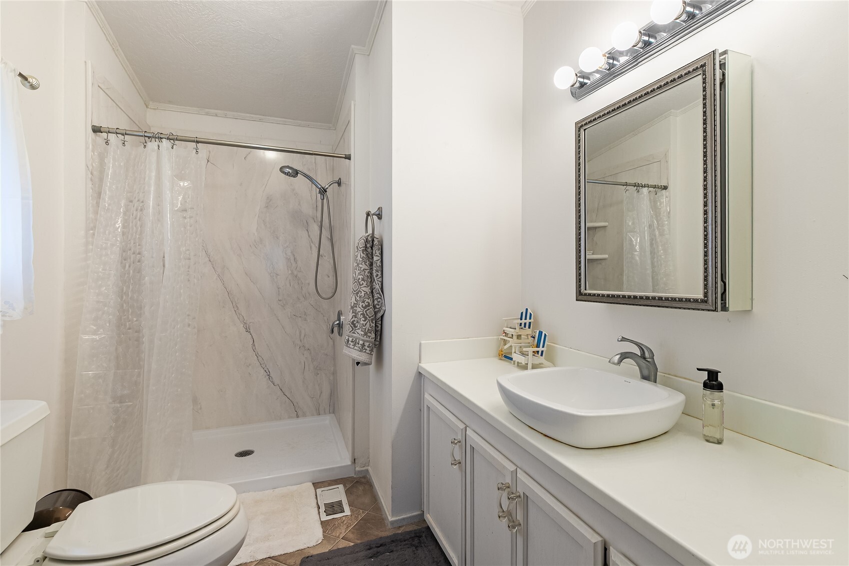 2350 Douglas Road, Unit 17 Ferndale, WA 98248 - Photo 24 of 32 a bathroom with a sink toilet and shower