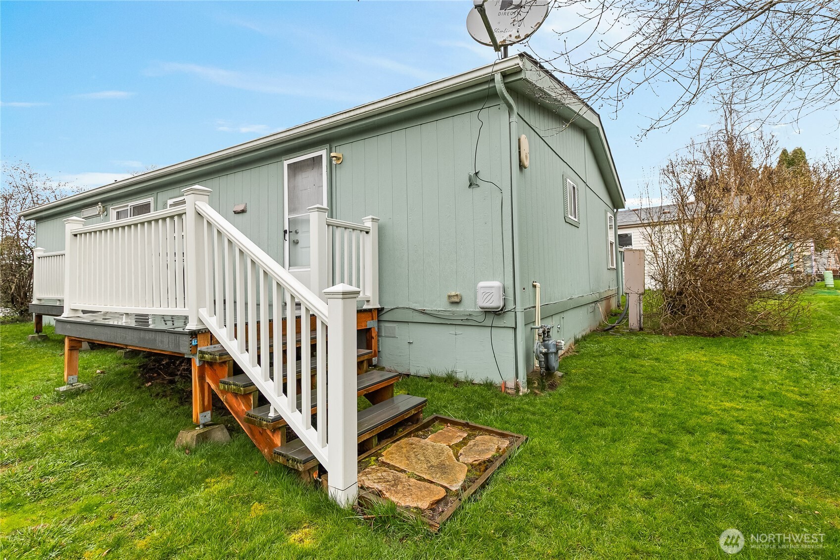 2350 Douglas Road, Unit 17 Ferndale, WA 98248 - Photo 4 of 32 a view of backyard with deck and garden