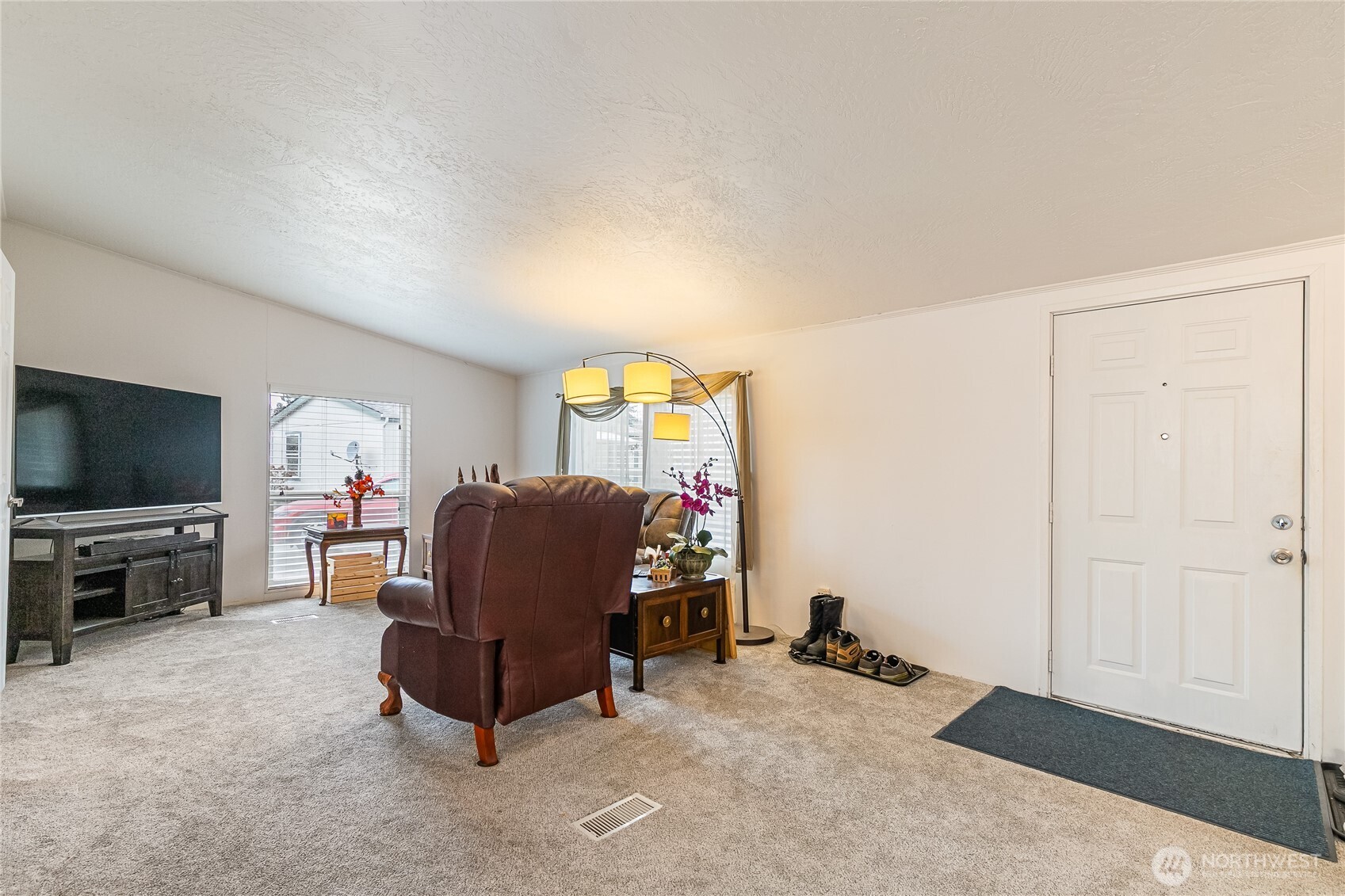 2350 Douglas Road, Unit 17 Ferndale, WA 98248 - Photo 10 of 32 a living room with furniture and a flat screen tv
