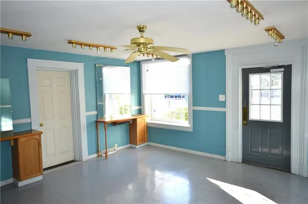 a view of an empty room with a window