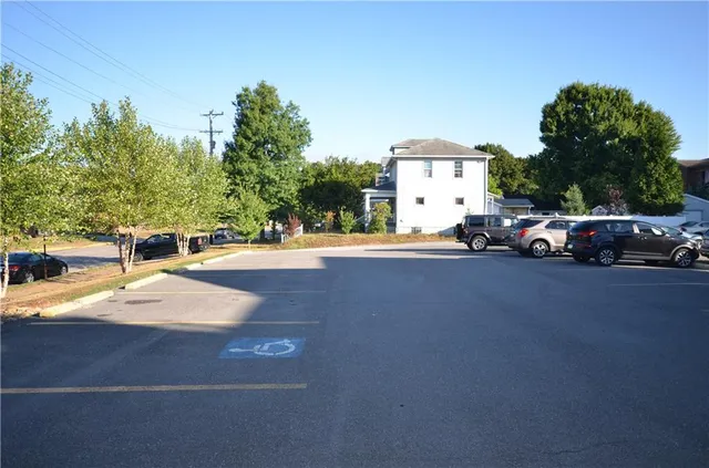 a view of street with parked cars