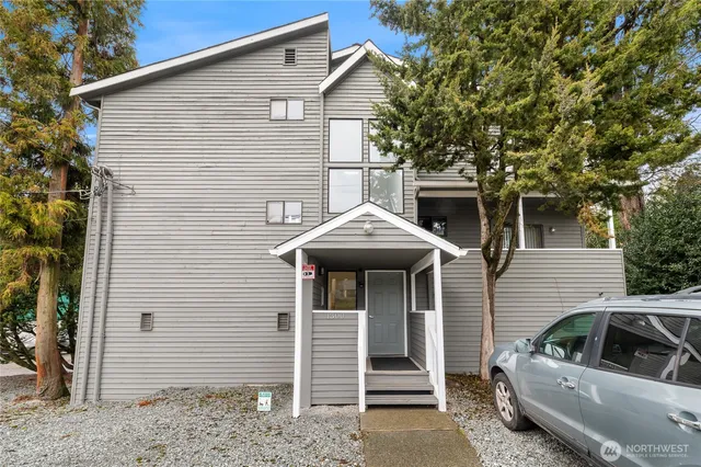 a front view of a house with parking space