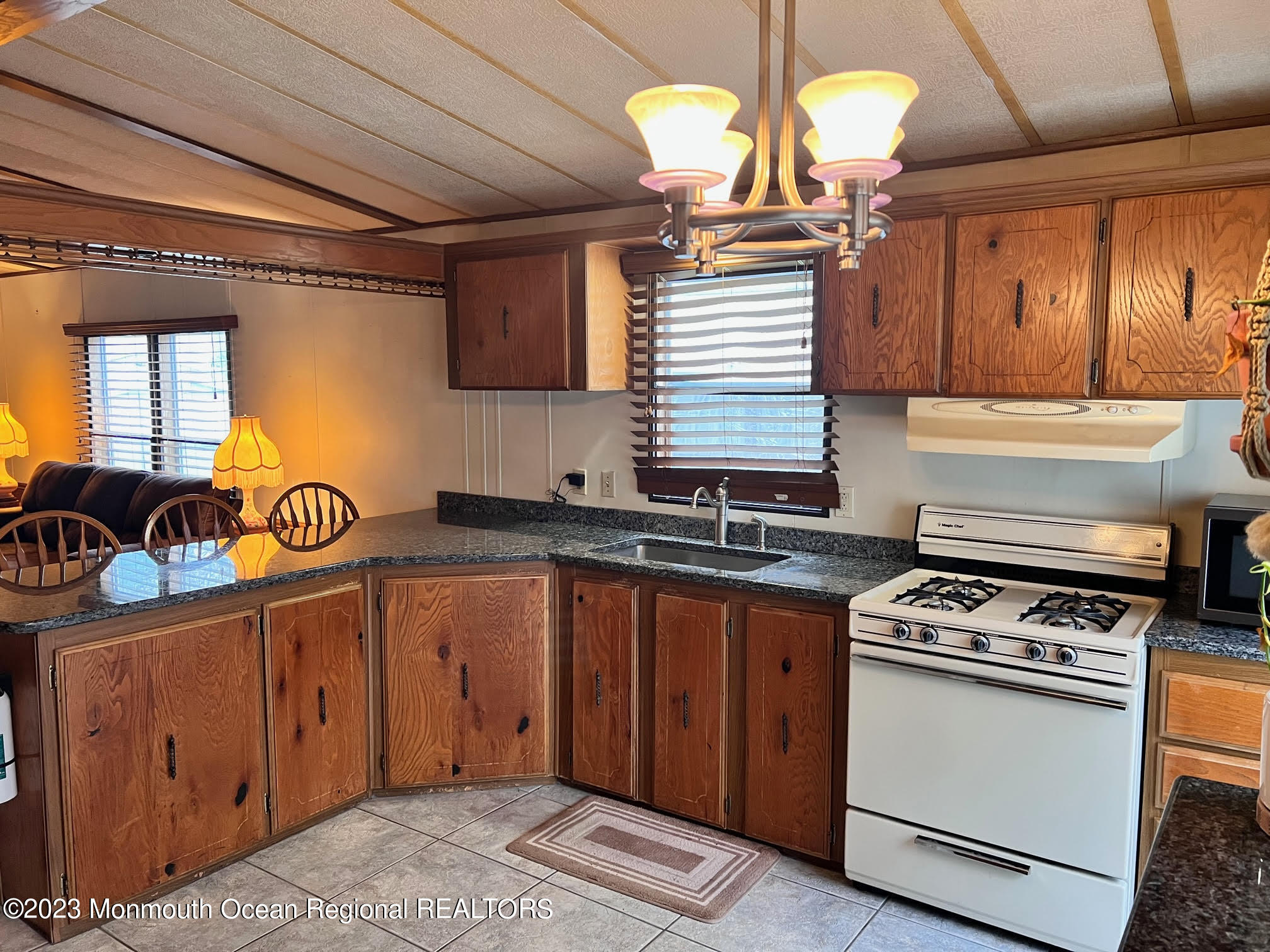 68 Shorehaven Road Hazlet, NJ 07730 - Photo 4 of 15 a kitchen with stainless steel appliances granite countertop a stove a sink and a granite counter tops