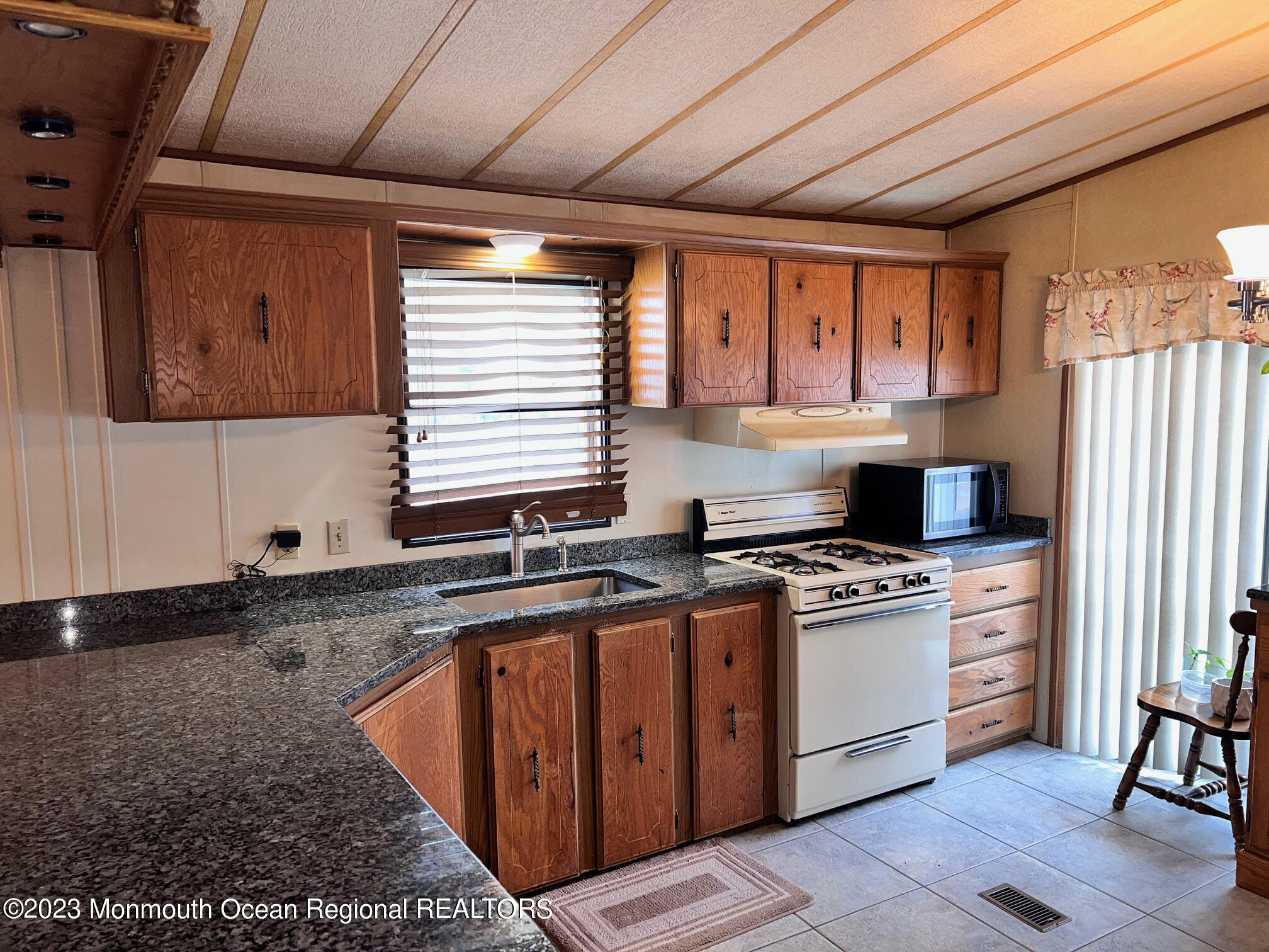 68 Shorehaven Road Hazlet, NJ 07730 - Photo 5 of 15 a kitchen with stainless steel appliances granite countertop a sink stove and refrigerator