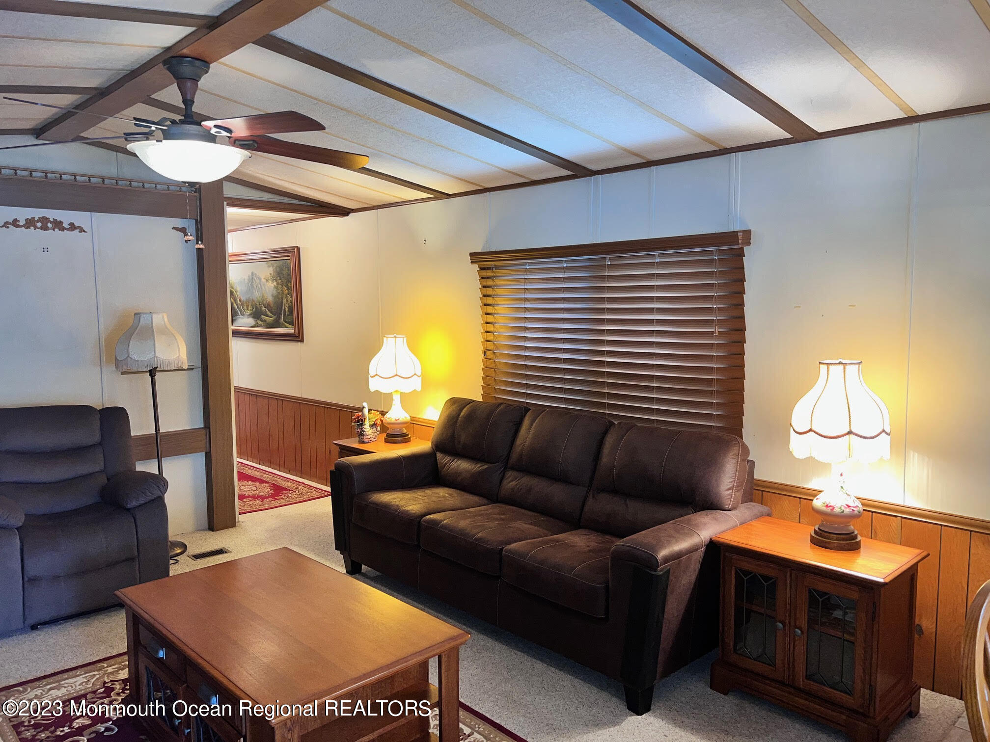 68 Shorehaven Road Hazlet, NJ 07730 - Photo 7 of 15 a living room with furniture a window and a lamp