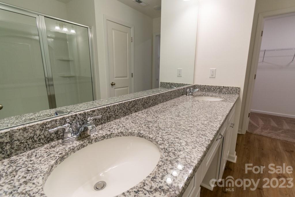 2173 Country Club Drive Lancaster, SC 29720 - Photo 16 of 18 a bathroom with a granite countertop sink and vanity