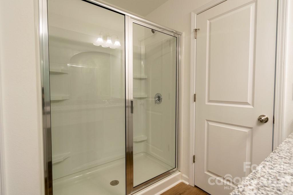 2173 Country Club Drive Lancaster, SC 29720 - Photo 18 of 18 a bathroom with a glass shower door