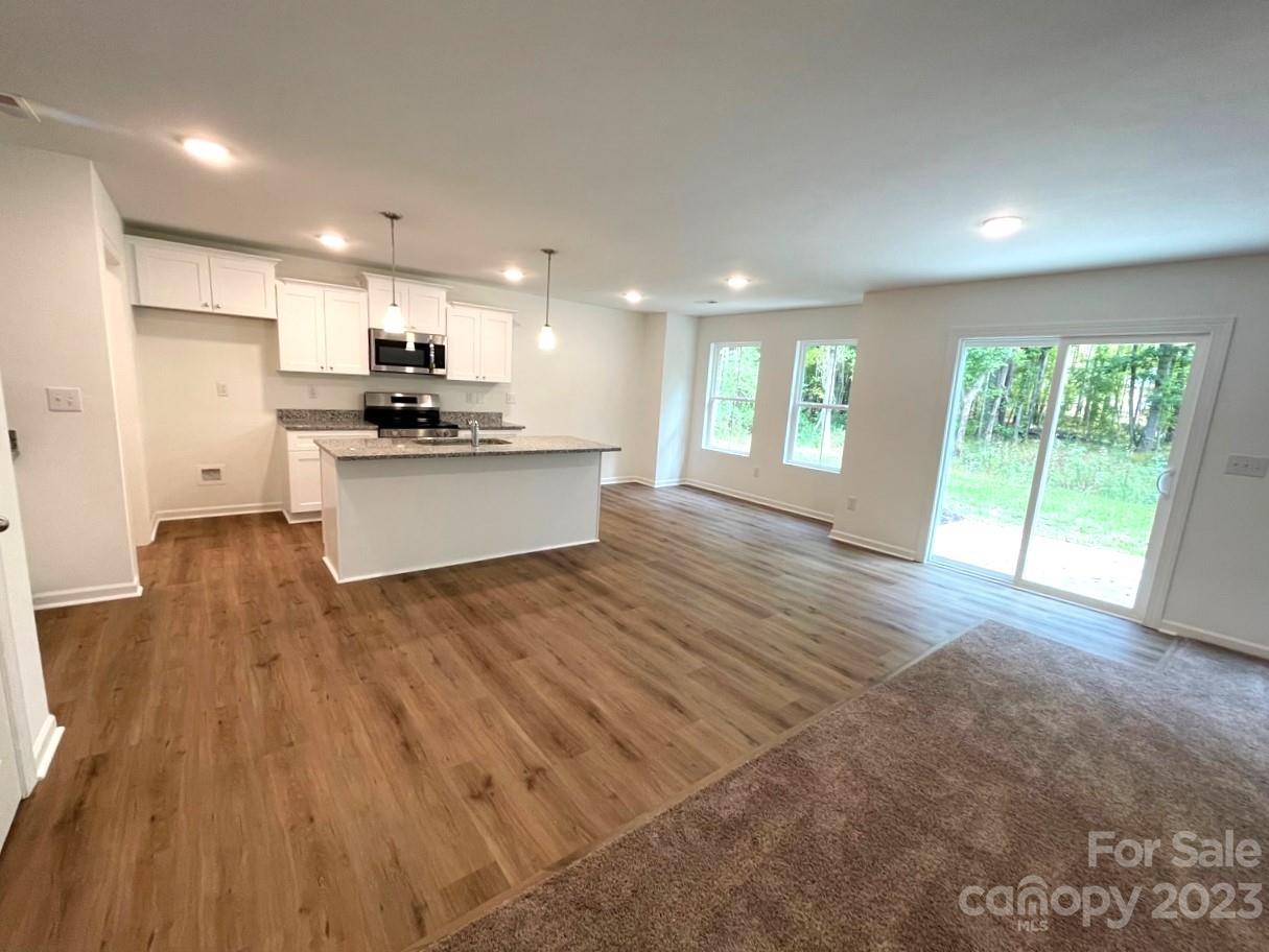2173 Country Club Drive Lancaster, SC 29720 - Photo 5 of 18 a large kitchen with stainless steel appliances granite countertop a large counter top a sink and a refrigerator